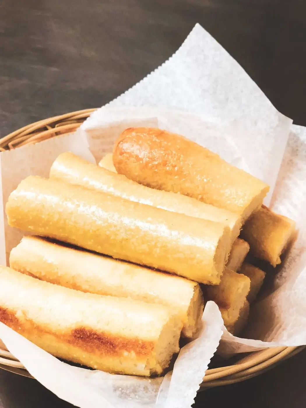 A basket of golden Basil Boys breadstix