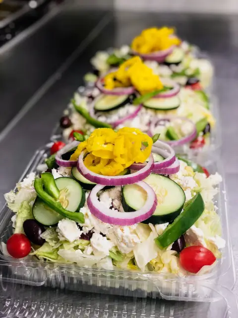 A long tray of Greek salad