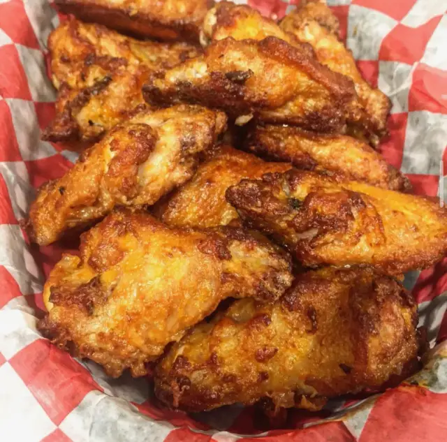 A basket of BBQ chicken wings