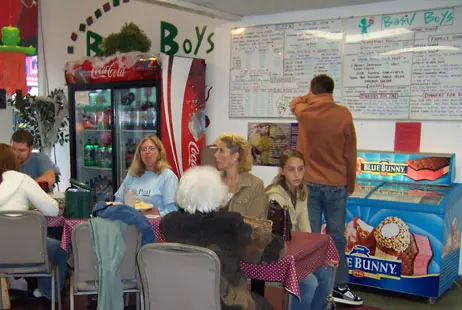 Guests ordering at the counter inside Basil Boys
